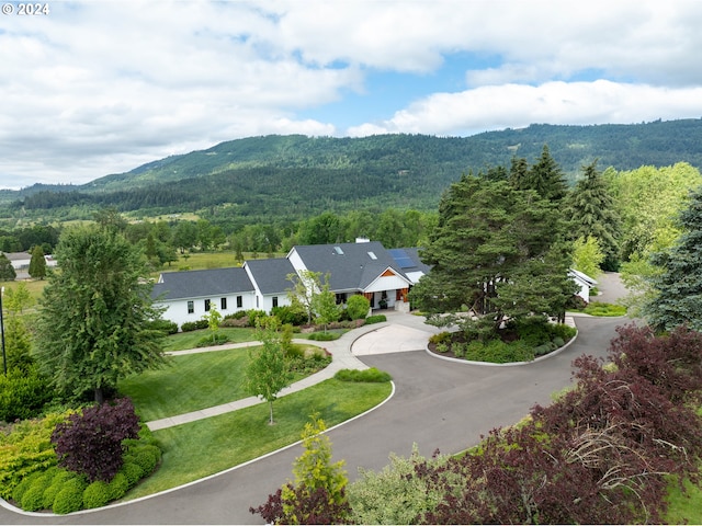 birds eye view of property featuring a mountain view