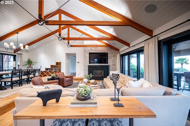 33723 Van Duyn Rd, Eugene, OR 97408 - living area with wood finished floors, a chandelier, and a fireplace