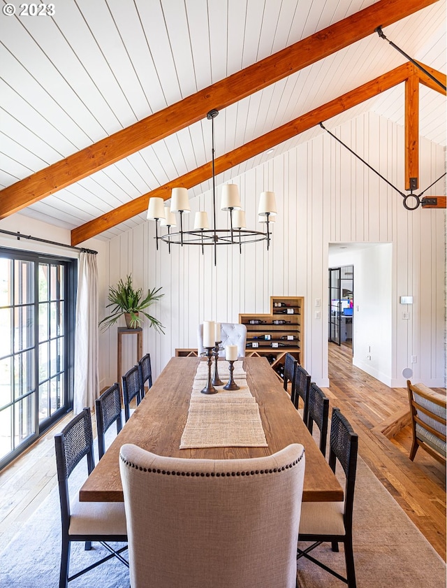 33723 Van Duyn Rd, Eugene, OR 97408 - dining area featuring hardwood / wood-style flooring, a chandelier, and wood walls