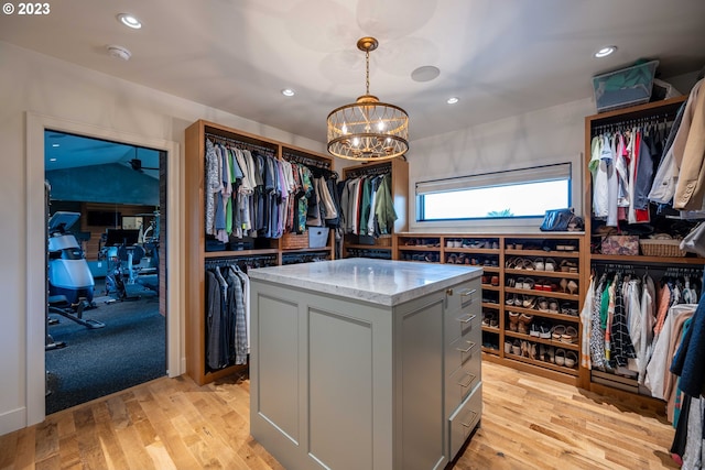 33723 Van Duyn Rd, Eugene, OR 97408 - walk in closet featuring a chandelier and light wood finished floors