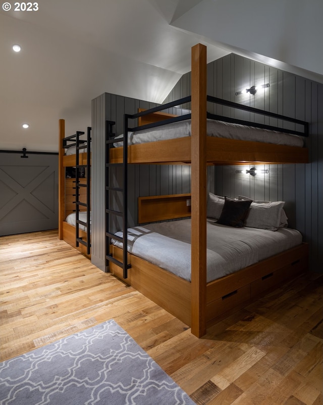 33723 Van Duyn Rd, Eugene, OR 97408 - bedroom featuring vaulted ceiling, wood finished floors, and recessed lighting