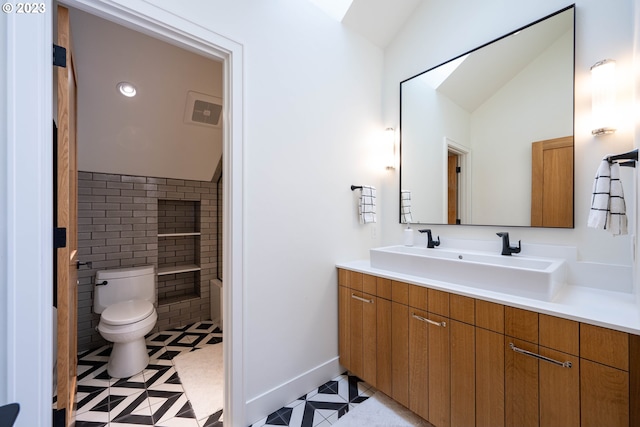 33723 Van Duyn Rd, Eugene, OR 97408 - full bathroom with vaulted ceiling, toilet, tile patterned flooring, vanity, and baseboards