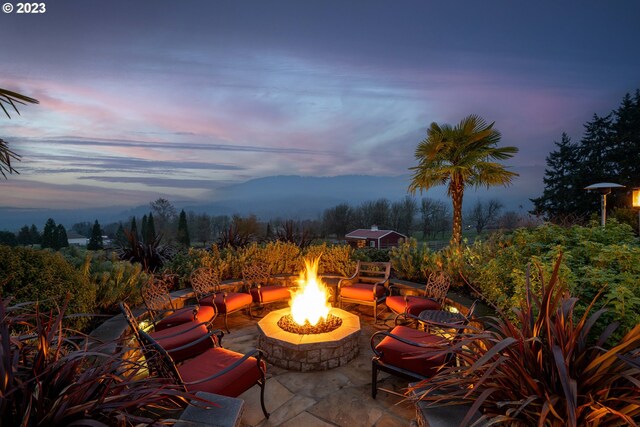 33723 Van Duyn Rd, Eugene, OR 97408 - patio terrace at dusk featuring a fire pit
