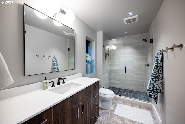 33723 Van Duyn Rd, Eugene, OR 97408 - bathroom with a shower stall, toilet, vanity, recessed lighting, and tile patterned flooring