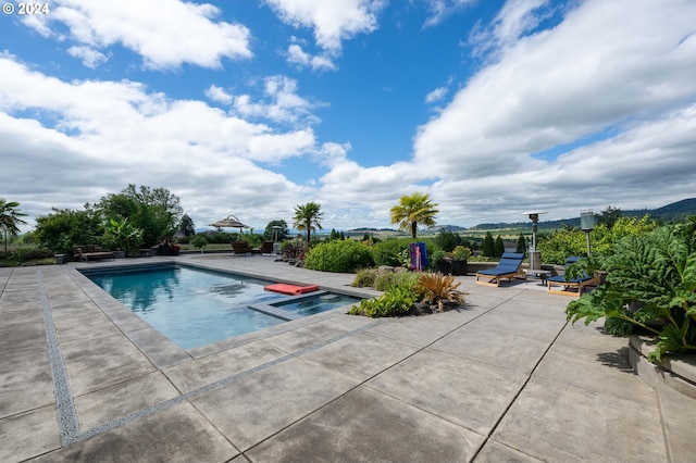 33723 Van Duyn Rd, Eugene, OR 97408 - view of pool featuring a patio area and a pool with connected hot tub