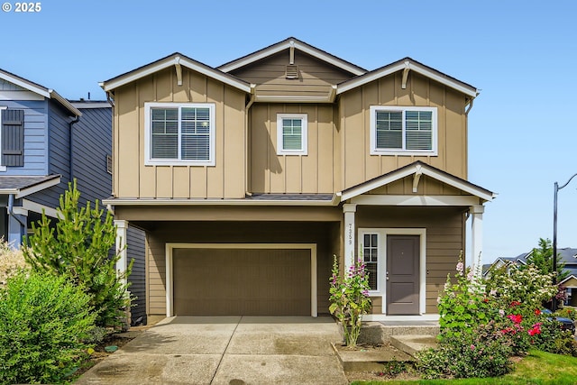 7359 NW 168th Ave, Portland, OR 97229 - view of front facade featuring board and batten siding, an attached garage, and driveway