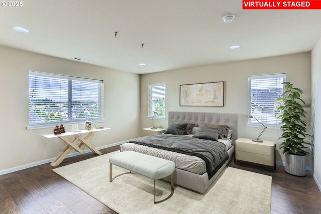 7359 NW 168th Ave, Portland, OR 97229 - bedroom with multiple windows, dark wood-style floors, and recessed lighting