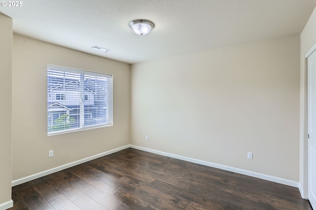 7359 NW 168th Ave, Portland, OR 97229 - spare room featuring dark wood-type flooring and baseboards