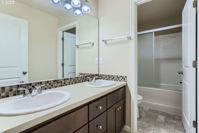 7359 NW 168th Ave, Portland, OR 97229 - full bathroom with double vanity,  shower combination, decorative backsplash, and stone finish floors