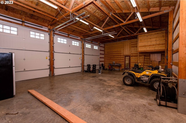 garage with black fridge