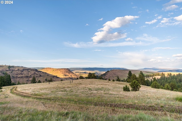 view of mountain feature with a rural view