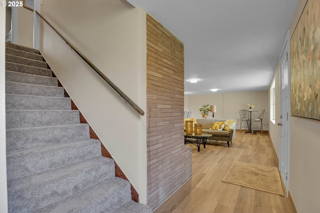 stairway featuring hardwood / wood-style floors