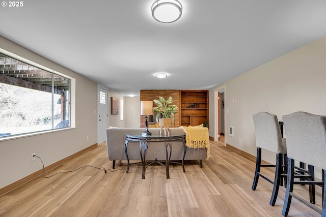 dining space with light hardwood / wood-style floors