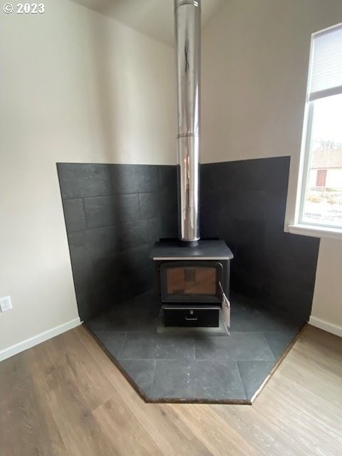 223 N Johnson St, Prairie City, OR 97869 - detailed view of a wood stove and wood finished floors