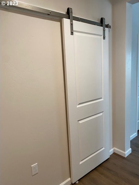 223 N Johnson St, Prairie City, OR 97869 - detailed view of wood finished floors and a barn door