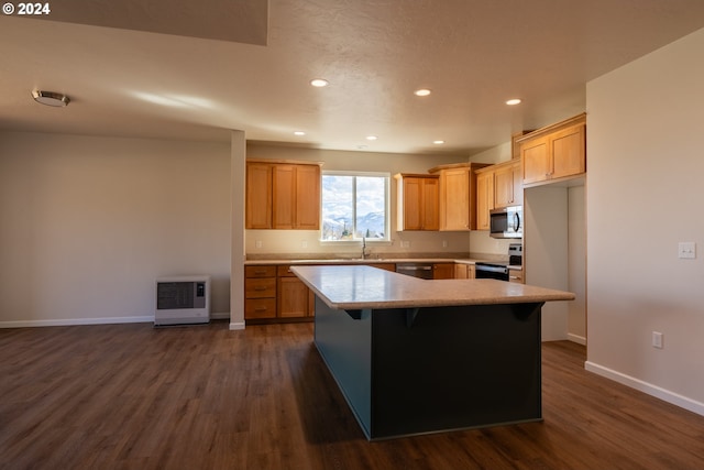 223 N Johnson St, Prairie City, OR 97869 - kitchen featuring stainless steel appliances, heating unit, dark wood-type flooring, light countertops, and recessed lighting