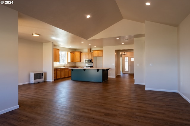 223 N Johnson St, Prairie City, OR 97869 - kitchen featuring stainless steel appliances, heating unit, open floor plan, dark wood finished floors, and high vaulted ceiling