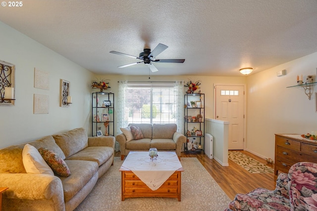 10614 NE 113th Ave, Vancouver, WA 98662 - living room with wood finished floors, ceiling fan, and a textured ceiling