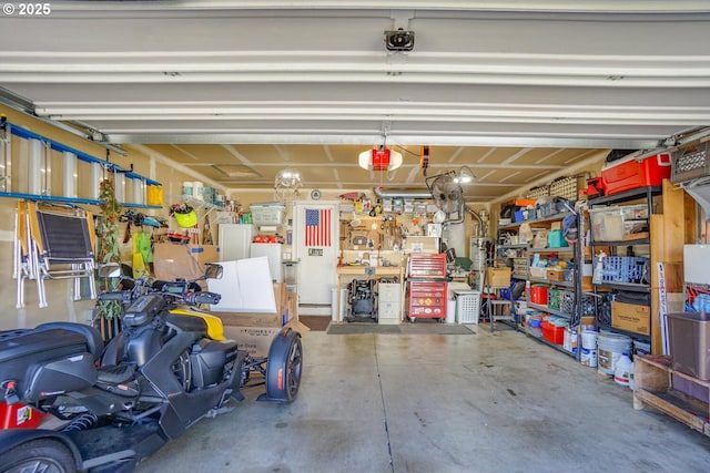 10614 NE 113th Ave, Vancouver, WA 98662 - garage with a garage door opener and a workshop area
