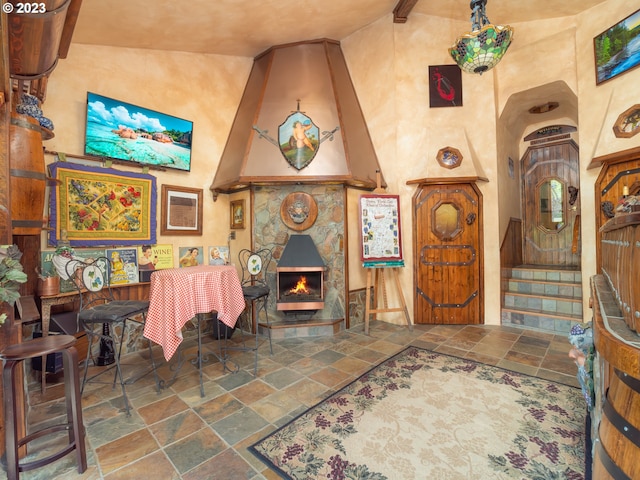 tiled foyer with lofted ceiling