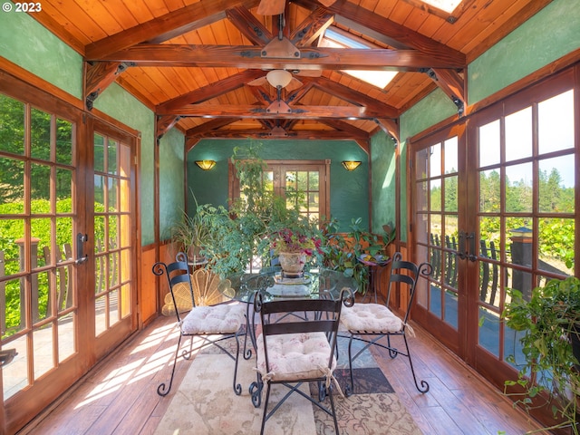 sunroom / solarium featuring french doors and wood ceiling