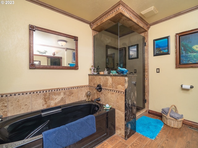 bathroom with crown molding, shower with separate bathtub, and hardwood / wood-style flooring