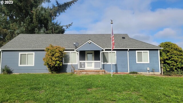 ranch-style home featuring a front yard