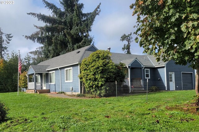 view of front of house with a front yard and a porch