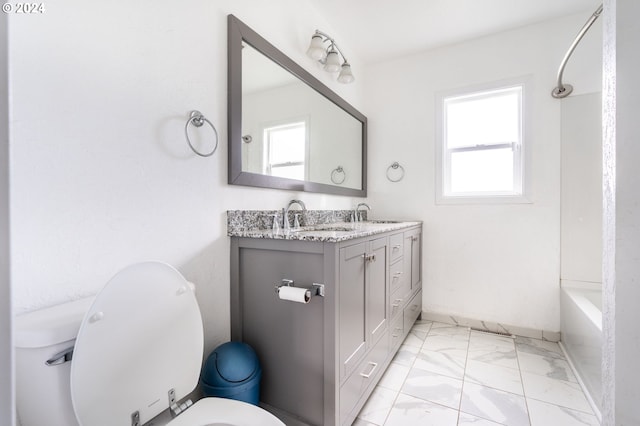 full bathroom with shower / bathing tub combination, vanity, and toilet