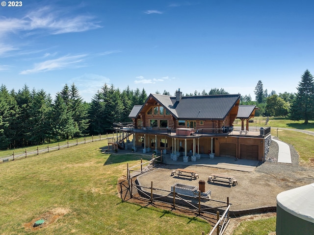 rear view of property with a yard and a patio area