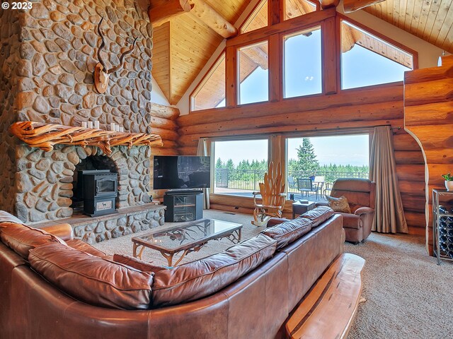 carpeted living room with wood ceiling, beamed ceiling, rustic walls, a fireplace, and high vaulted ceiling