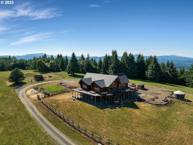 birds eye view of property with a rural view