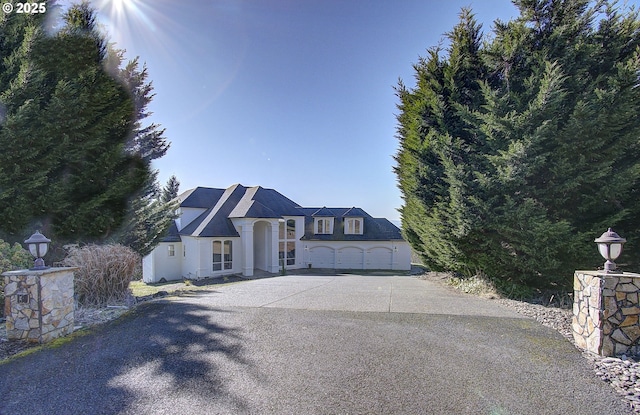view of front of house featuring a garage and concrete driveway