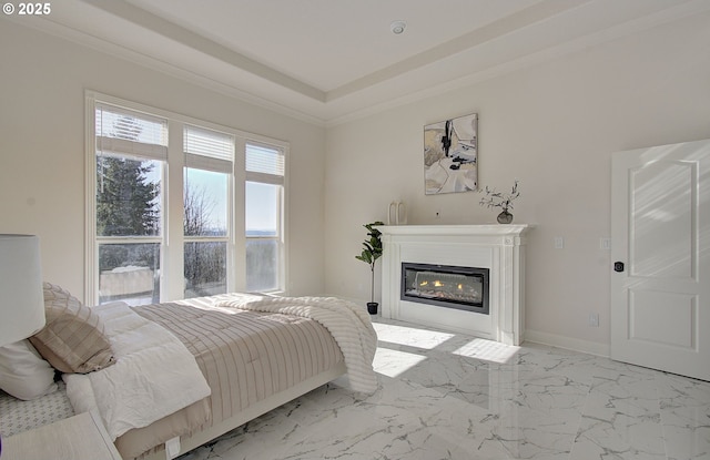 bedroom featuring marble finish floor and a glass covered fireplace