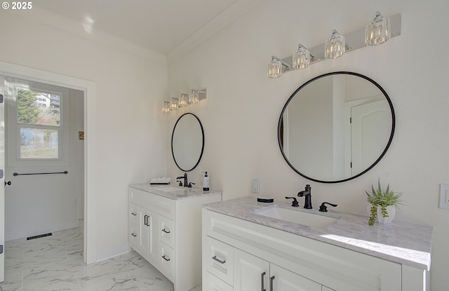 bathroom with two vanities, baseboards, marble finish floor, and a sink