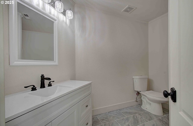 bathroom with baseboards, visible vents, toilet, and vanity
