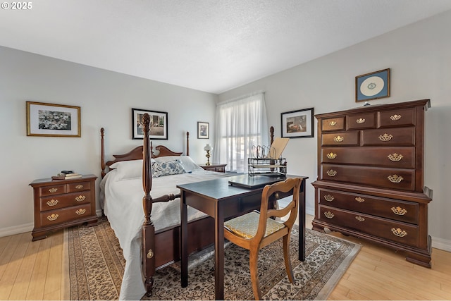 5250 S Landing Dr Unit 111B1, Portland, OR 97239 - bedroom with light wood-style flooring and baseboards