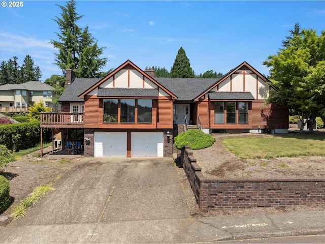 11185 SE Saint Lucy Ln, Happy Valley, OR 97086 - view of front of house featuring an attached garage, driveway, brick siding, and roof with shingles
