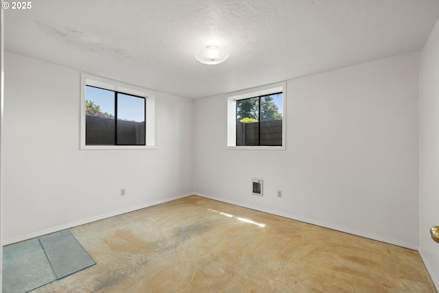 11185 SE Saint Lucy Ln, Happy Valley, OR 97086 - spare room featuring baseboards and heating unit