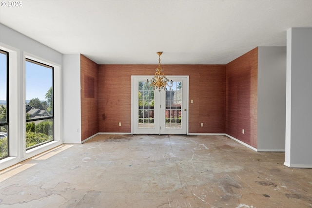 11185 SE Saint Lucy Ln, Happy Valley, OR 97086 - unfurnished dining area featuring a chandelier and baseboards