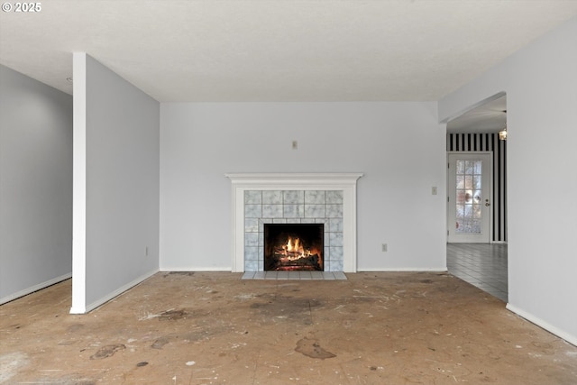 11185 SE Saint Lucy Ln, Happy Valley, OR 97086 - unfurnished living room with a tile fireplace and baseboards