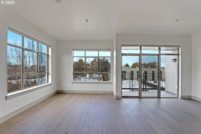 spare room featuring light wood-type flooring