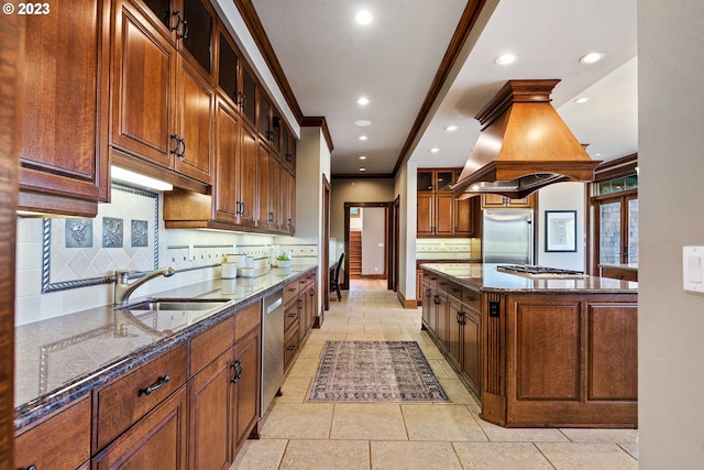 kitchen with dark stone countertops, custom range hood, backsplash, and stainless steel appliances