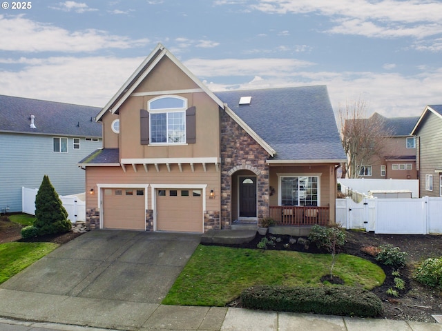 view of property featuring a garage and a front yard