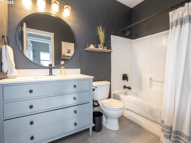 full bathroom featuring vanity, shower / bath combination with curtain, and toilet