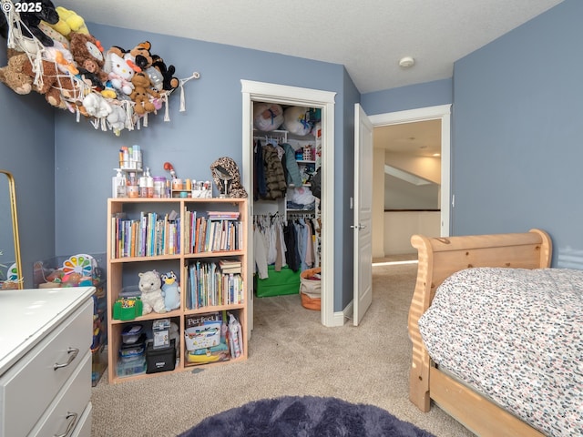 carpeted bedroom with a closet and a textured ceiling