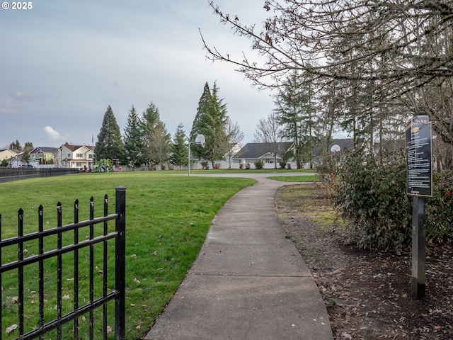 view of property's community with a lawn