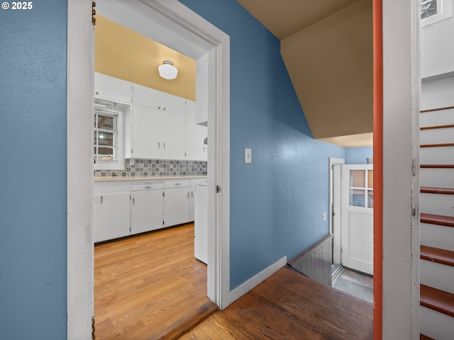 510 SE Shafford St, Estacada, OR 97023 - hall with light wood-type flooring, baseboards, and stairs