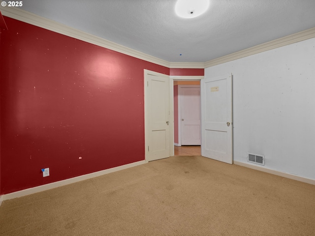 510 SE Shafford St, Estacada, OR 97023 - carpeted spare room with baseboards, visible vents, a textured ceiling, and ornamental molding