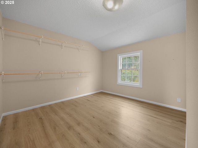 510 SE Shafford St, Estacada, OR 97023 - interior space with baseboards, vaulted ceiling, wood finished floors, and a textured ceiling